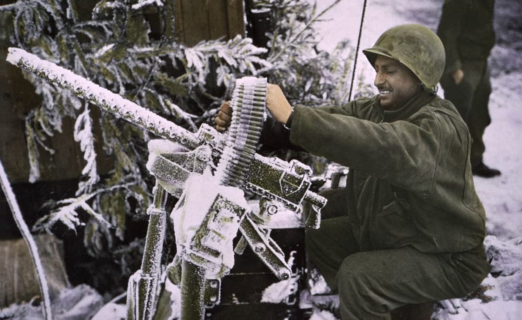 A member of Cavalry Reconnaissance Squadron checks a .30-caliber Machine Gun 